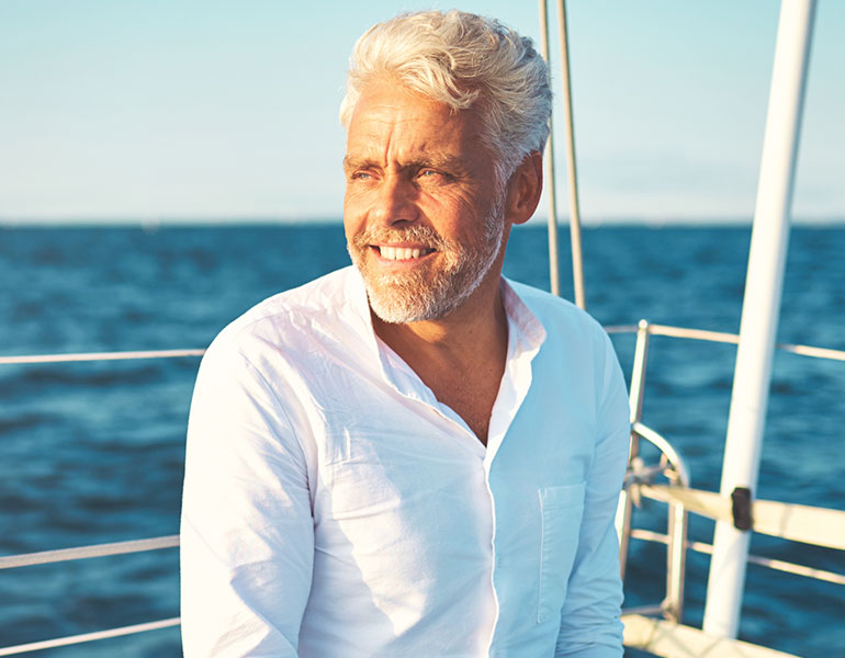Patient testimonial background featuring close-up male hair and scalp improvement